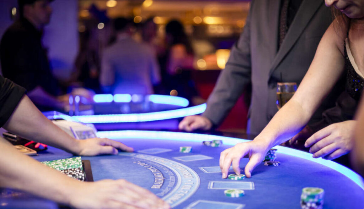 dealer dealing cards to patrons at a table rental event