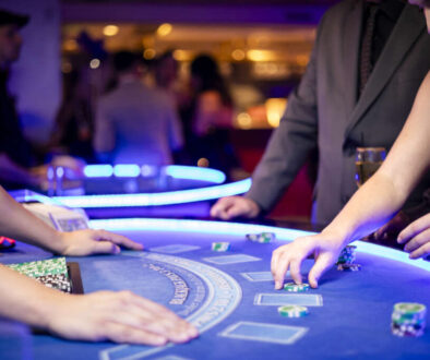 dealer dealing cards to patrons at a table rental event